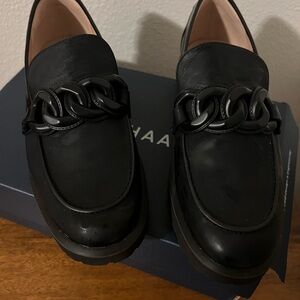 Black Cole Haan Loafers with Chain Detail